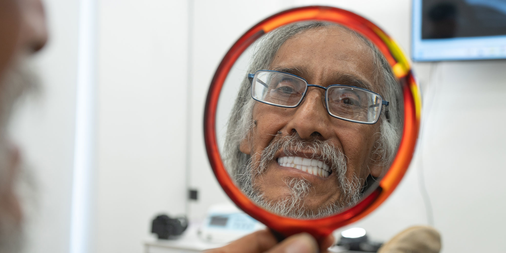 Patient Looking into Mirror Smiling