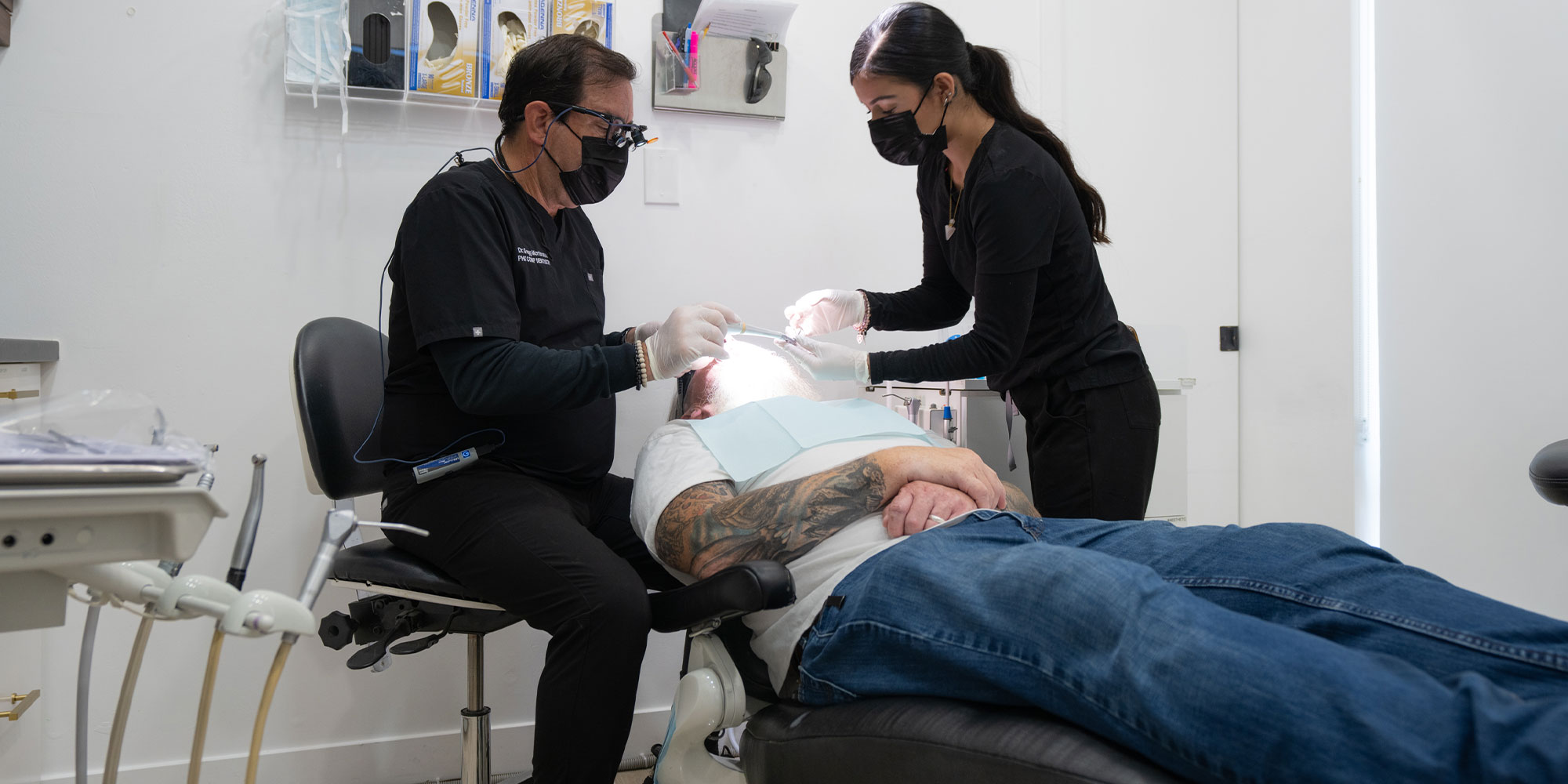 Doctor Cleaning Patients teeth