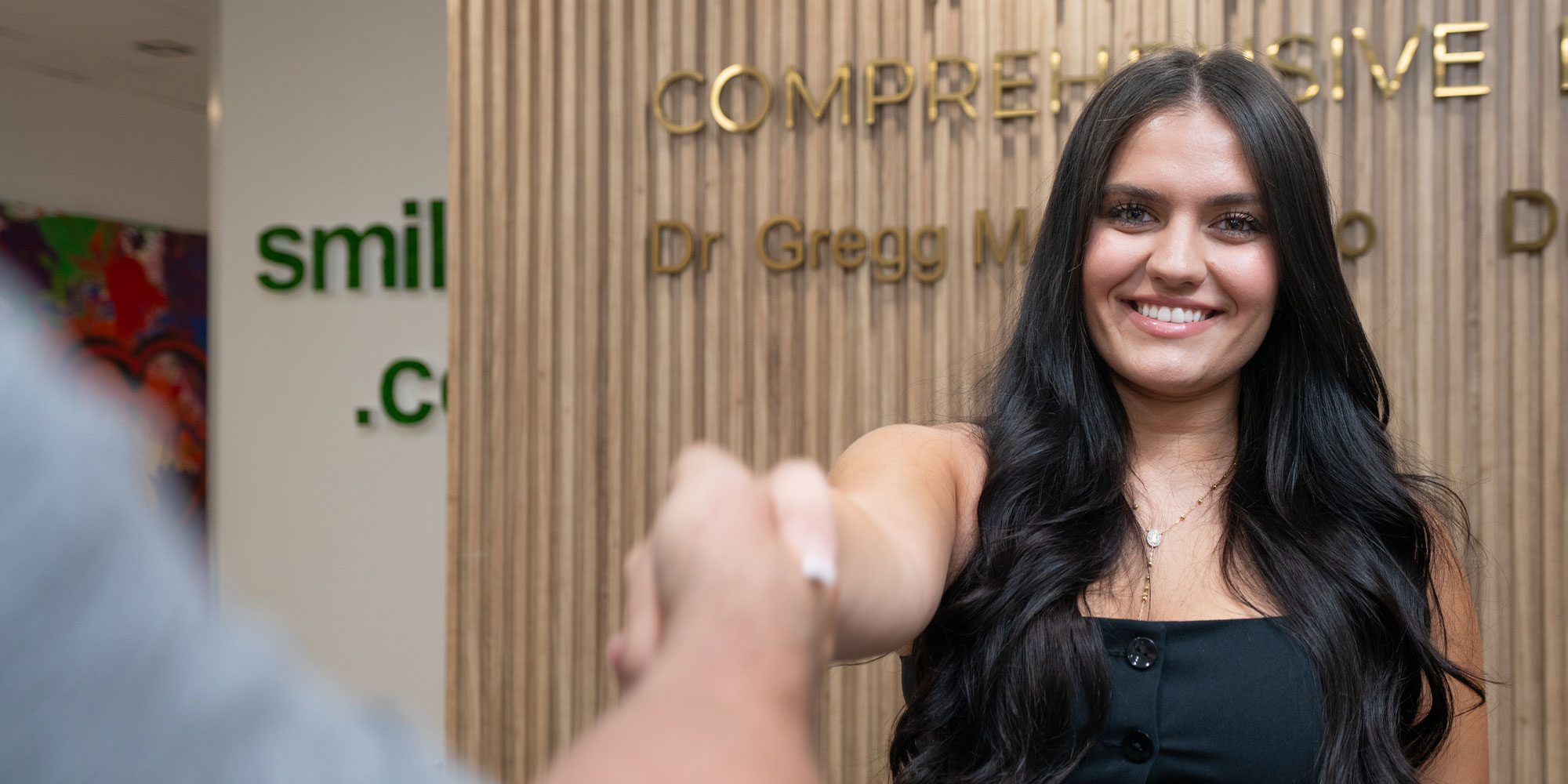 team member shaking Patients Hand