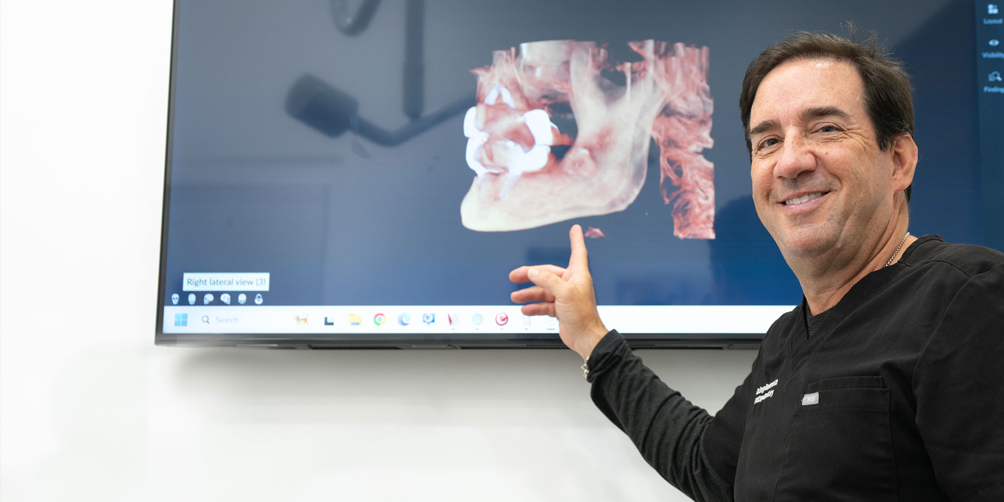 Doctor Pointing Patients X-ray